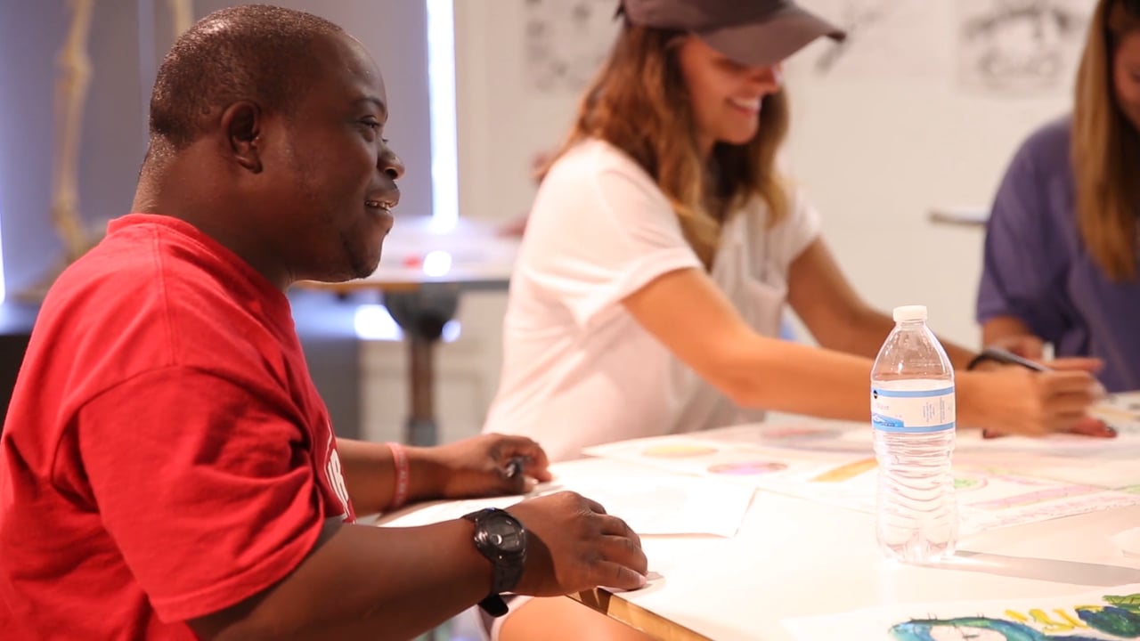 A CrossingPoints student sitting at a table during a class