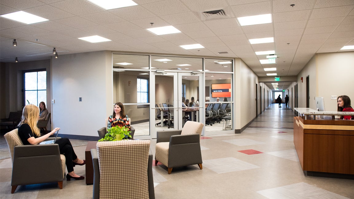 People sitting within the Plank Center.