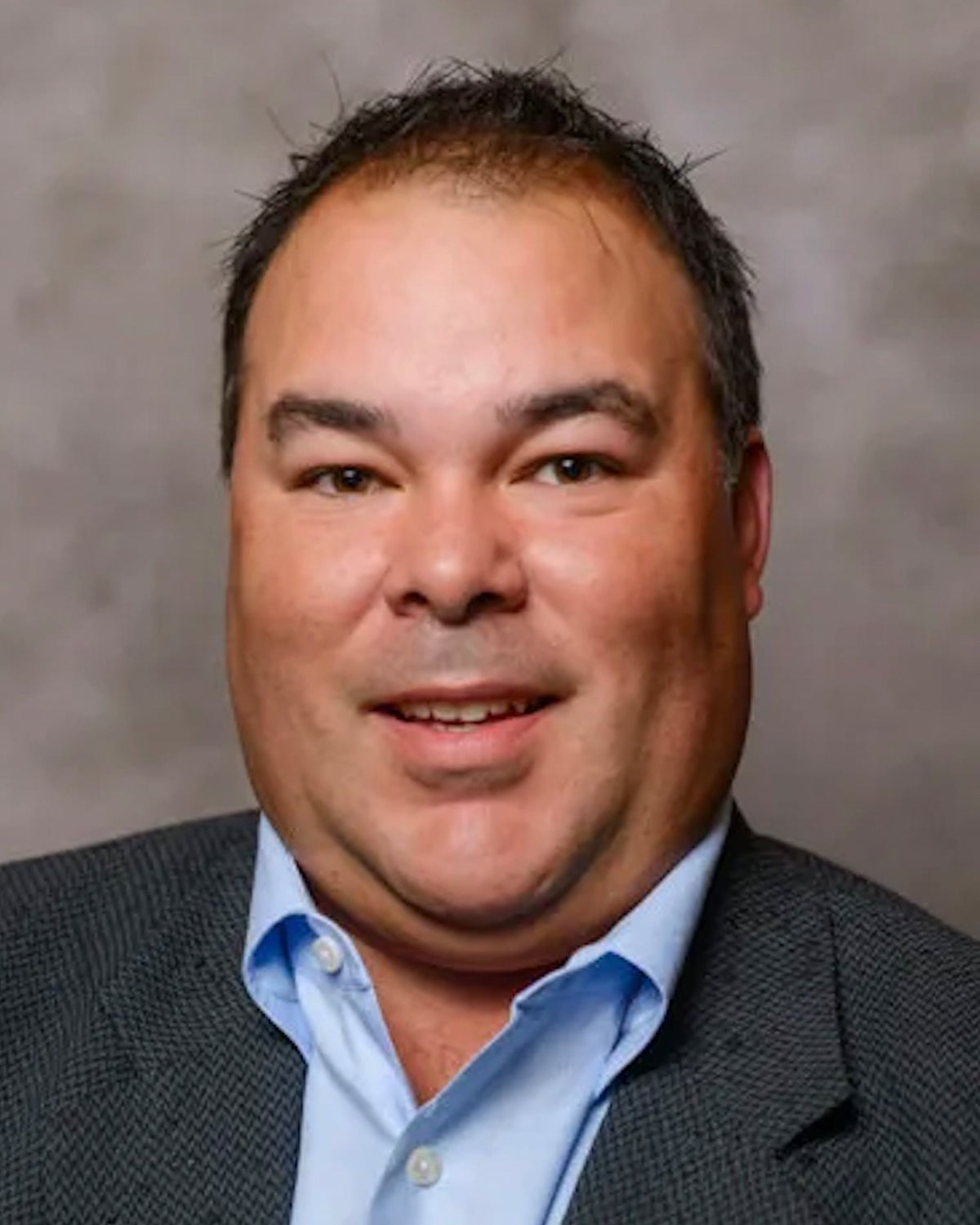 A headshot of John Burkhardt