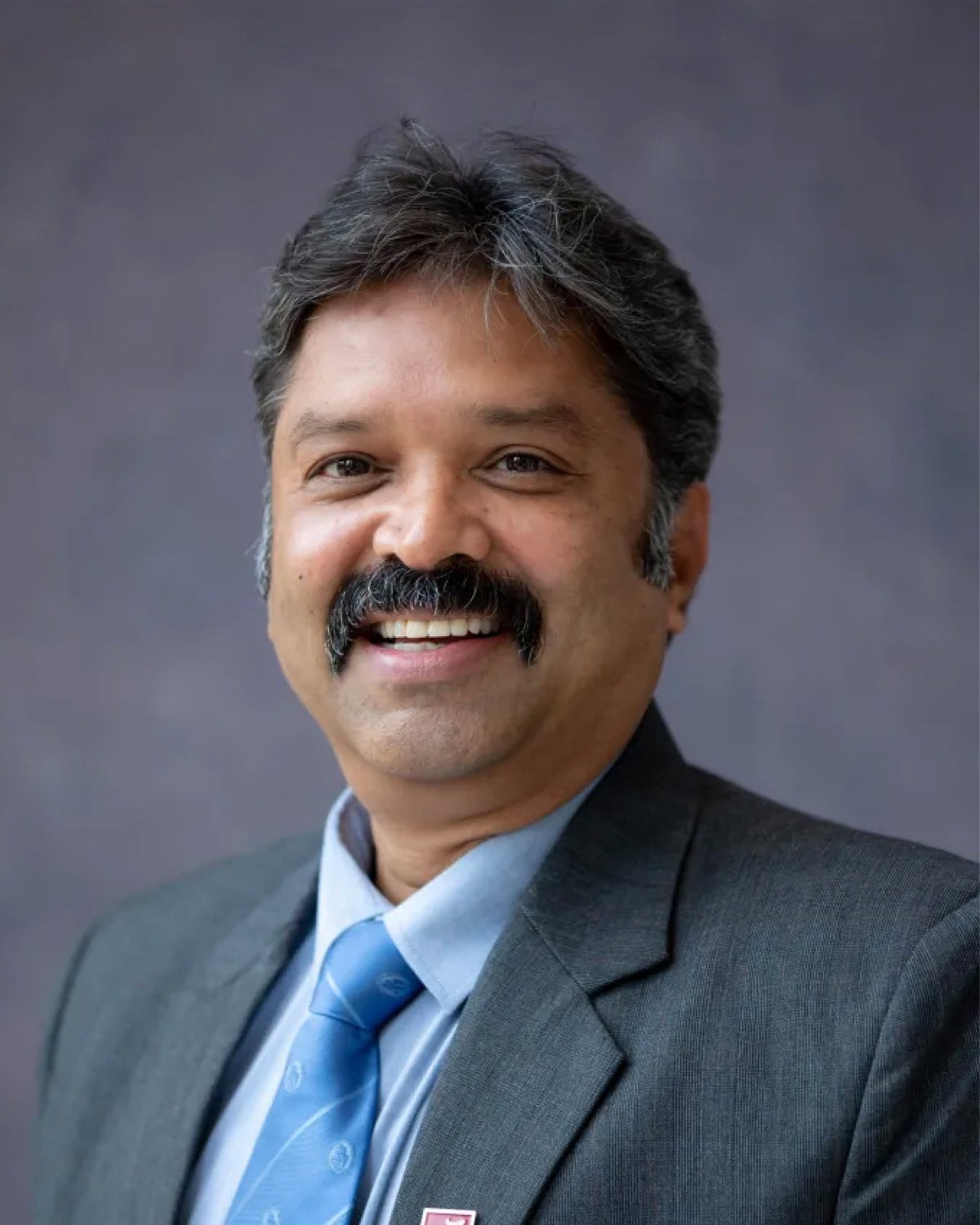A headshot of Ravi Kumar