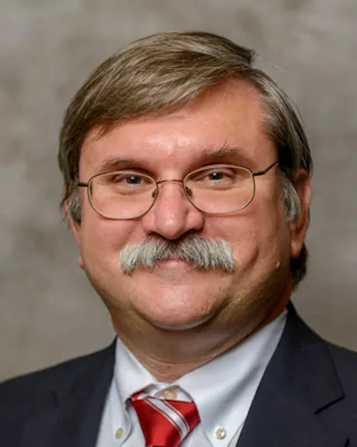 A headshot of Tom Weida